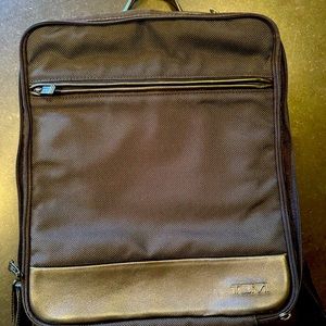 Tumi women’s backpack-has laptop pocket. Excellent brand new condition-